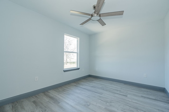 empty room featuring ceiling fan and light hardwood / wood-style floors