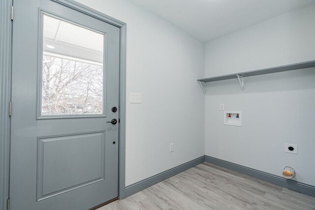 laundry area featuring washer hookup, electric dryer hookup, and light wood-type flooring