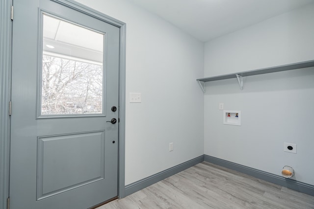 clothes washing area featuring washer hookup, light hardwood / wood-style flooring, and hookup for an electric dryer