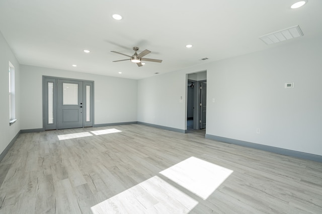 unfurnished room featuring ceiling fan and light hardwood / wood-style flooring