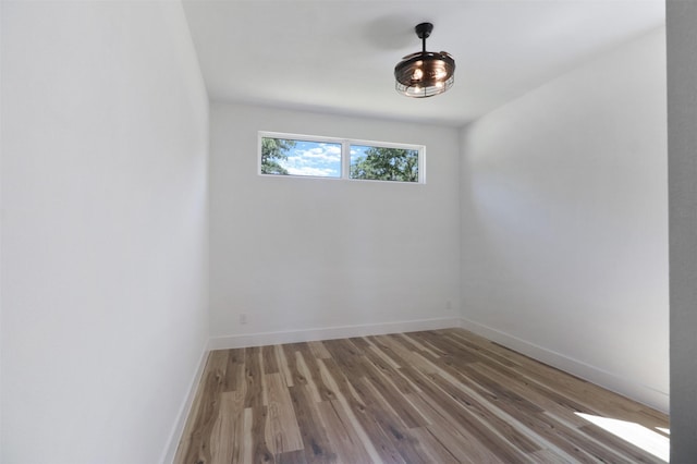 spare room featuring hardwood / wood-style flooring