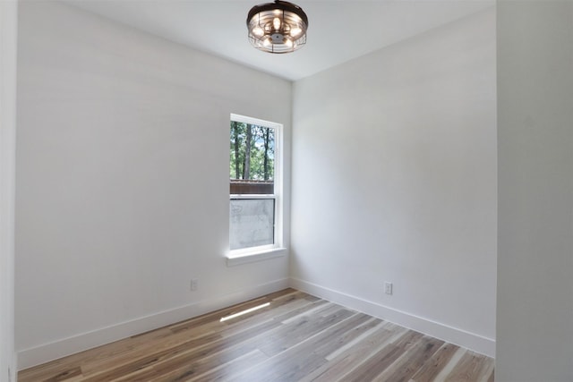 spare room featuring light wood-type flooring