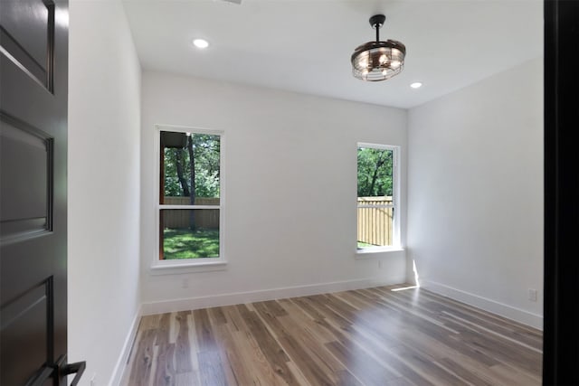 spare room featuring dark hardwood / wood-style flooring