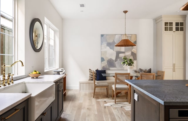 interior space with sink and light hardwood / wood-style flooring