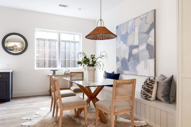 dining area with light hardwood / wood-style flooring