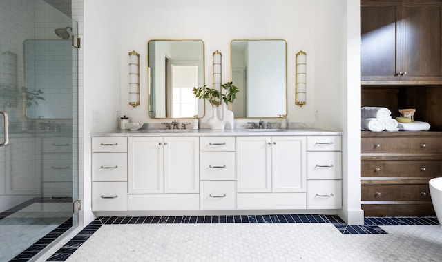 bathroom featuring tile patterned flooring, vanity, and a shower with shower door