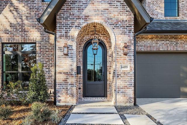 entrance to property featuring a garage