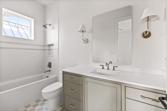 full bathroom with vanity, toilet, and tiled shower / bath