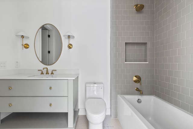 full bathroom with tile patterned floors, toilet, vanity, and tiled shower / bath