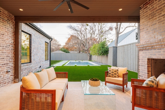 view of patio / terrace with an outdoor hangout area, a pool, and ceiling fan