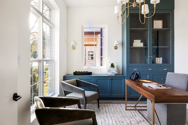 office area featuring a wealth of natural light and wood-type flooring