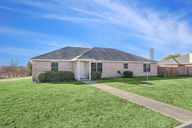 ranch-style home featuring a front yard