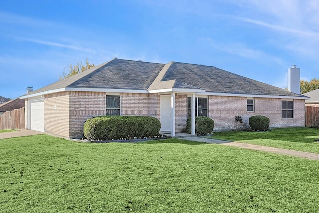 single story home featuring a front yard and a garage