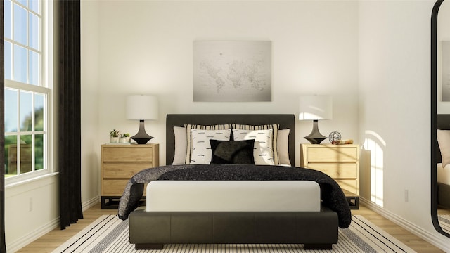 bedroom with light wood-type flooring