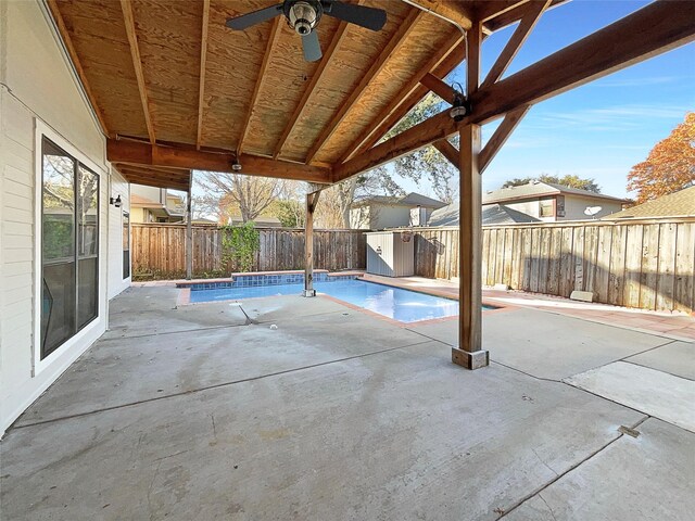 817 Foxridge Dr, Arlington, TX 76017 - view of pool featuring a shed, a fenced backyard, ceiling fan, and a patio