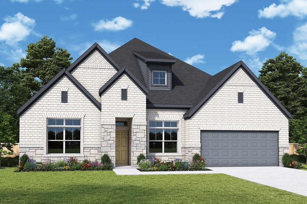 view of front facade with a front lawn and a garage