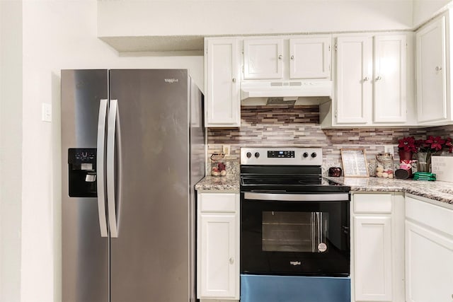 kitchen featuring white cabinetry, stainless steel appliances, light stone countertops, and backsplash