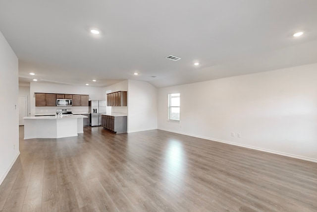 unfurnished living room featuring light hardwood / wood-style flooring