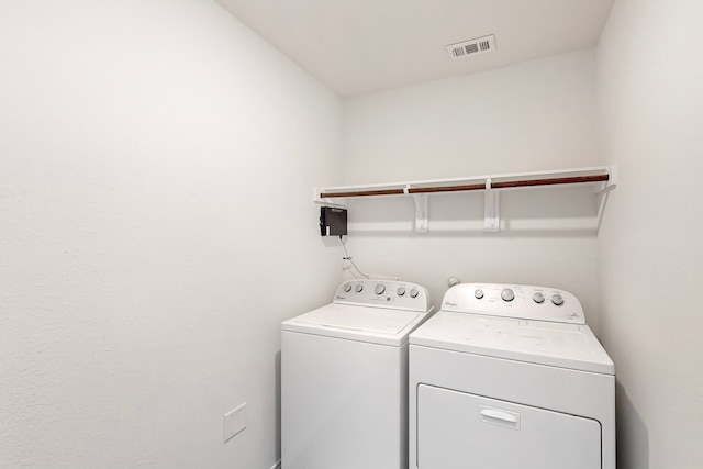 washroom featuring independent washer and dryer