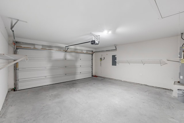 garage featuring a garage door opener and electric panel