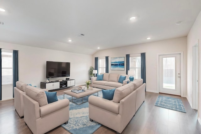 living room with light hardwood / wood-style flooring and lofted ceiling