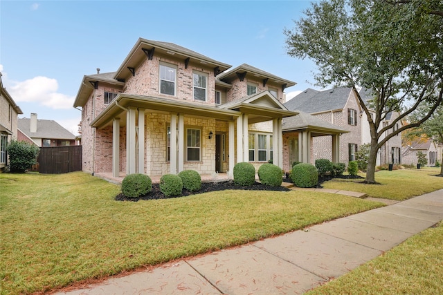 view of front of house featuring covered porch and a front lawn