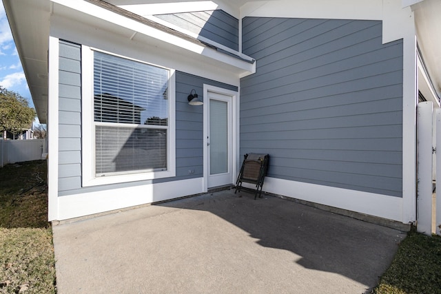 entrance to property featuring a patio