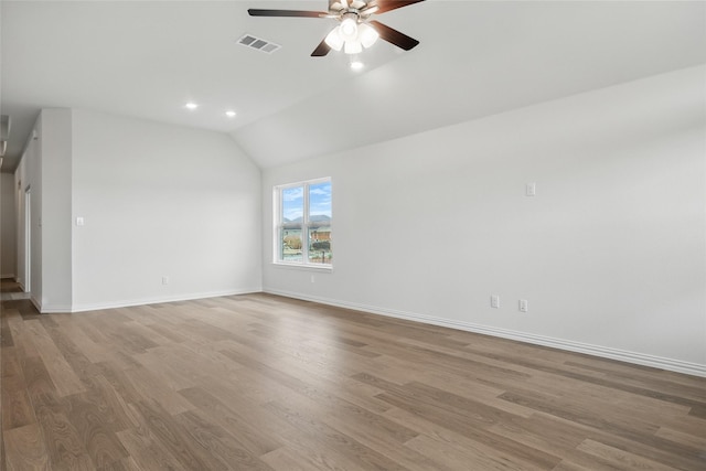 16213 Hidden Cove Dr, Celina, TX 75009 - spare room with visible vents, lofted ceiling, baseboards, light wood-style floors, and ceiling fan