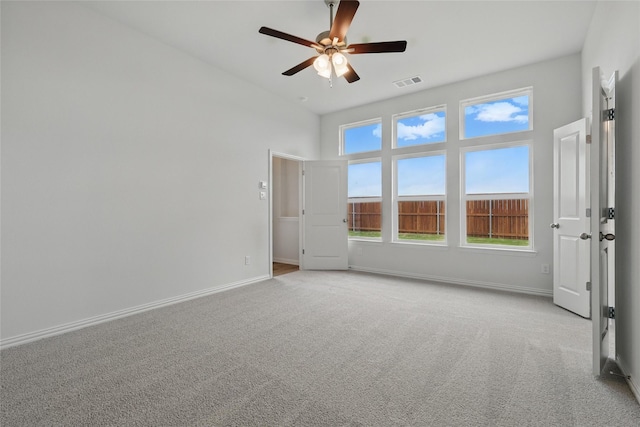 16213 Hidden Cove Dr, Celina, TX 75009 - carpeted empty room featuring a ceiling fan, baseboards, visible vents, and a towering ceiling