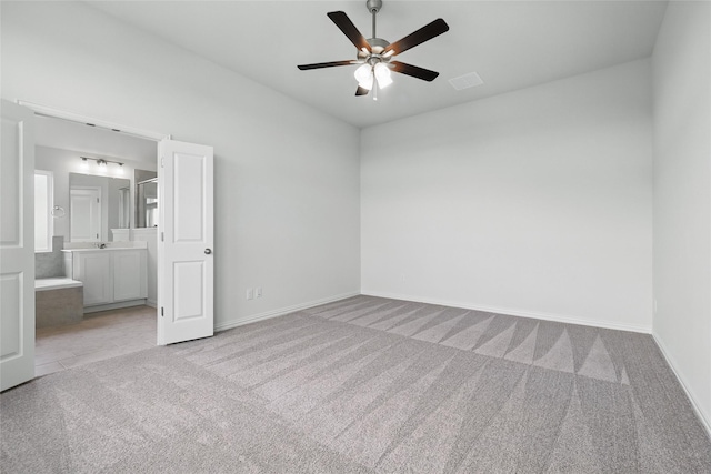 16213 Hidden Cove Dr, Celina, TX 75009 - unfurnished bedroom featuring carpet floors, connected bathroom, baseboards, and visible vents