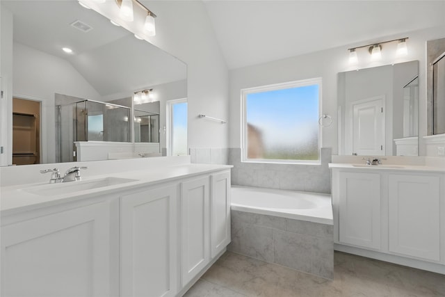 16213 Hidden Cove Dr, Celina, TX 75009 - full bathroom with vaulted ceiling, a sink, a bath, and a stall shower
