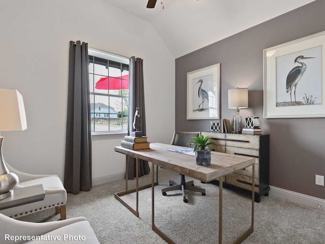 carpeted home office featuring ceiling fan and vaulted ceiling