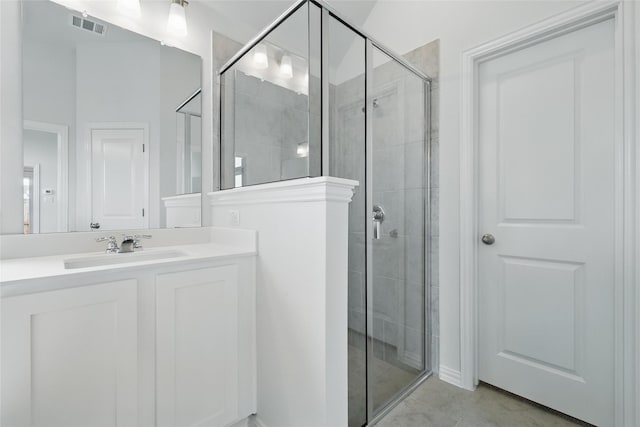 16213 Hidden Cove Dr, Celina, TX 75009 - full bath with vanity, a shower stall, tile patterned floors, and visible vents