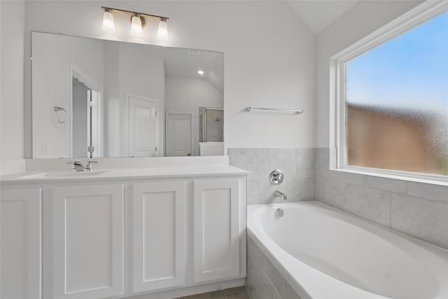 16213 Hidden Cove Dr, Celina, TX 75009 - full bath featuring vanity, a shower stall, vaulted ceiling, and a bath