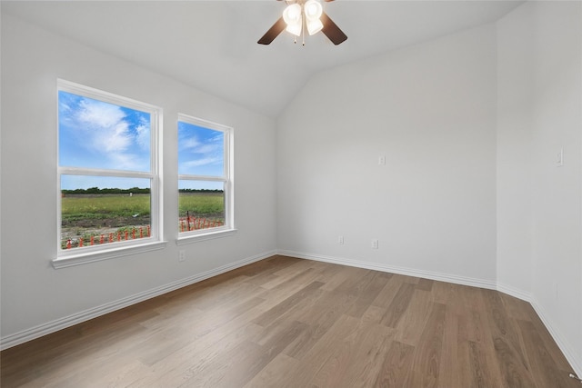 16213 Hidden Cove Dr, Celina, TX 75009 - spare room with baseboards, ceiling fan, wood finished floors, and lofted ceiling