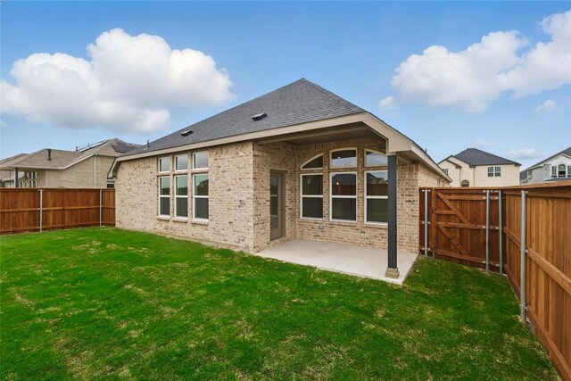 16213 Hidden Cove Dr, Celina, TX 75009 - rear view of house featuring a fenced backyard, a patio area, and brick siding