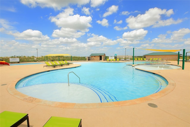 view of pool featuring a patio area