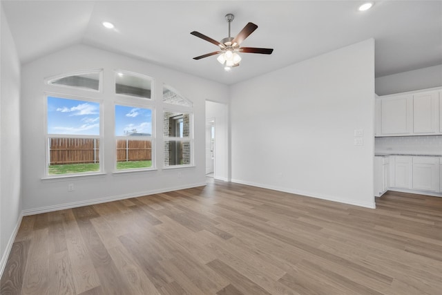 16213 Hidden Cove Dr, Celina, TX 75009 - unfurnished living room with baseboards, recessed lighting, a ceiling fan, light wood-style flooring, and vaulted ceiling