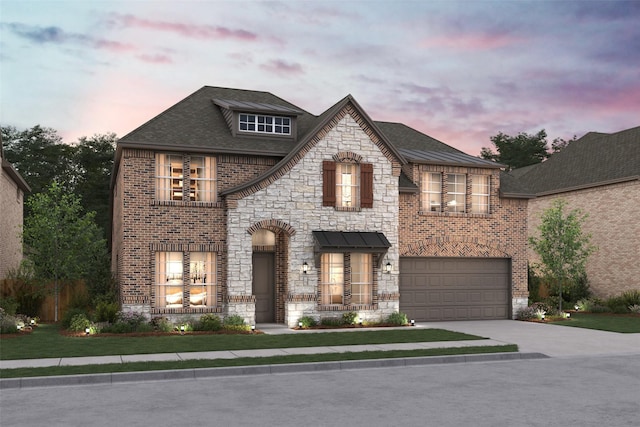 french country style house featuring stone siding, brick siding, driveway, and an attached garage