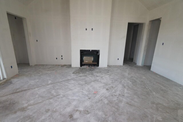 unfurnished living room featuring a fireplace