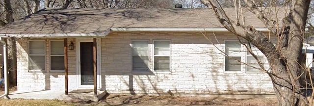 view of side of home featuring a patio area