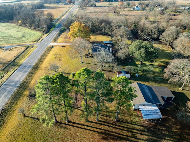 birds eye view of property with a rural view