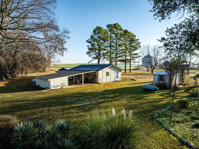 rear view of house with a lawn