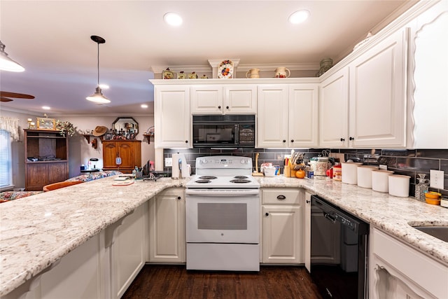 kitchen with hanging light fixtures, white cabinetry, ornamental molding, and black appliances