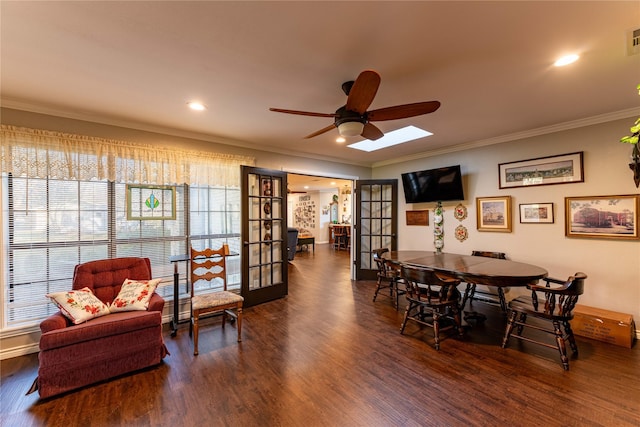 dining space featuring crown molding, dark hardwood / wood-style floors, ceiling fan, and french doors