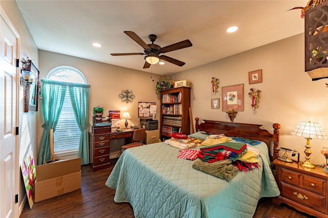 bedroom with ceiling fan and dark hardwood / wood-style floors