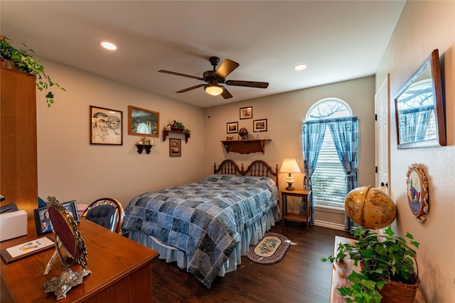 bedroom with ceiling fan and dark hardwood / wood-style floors