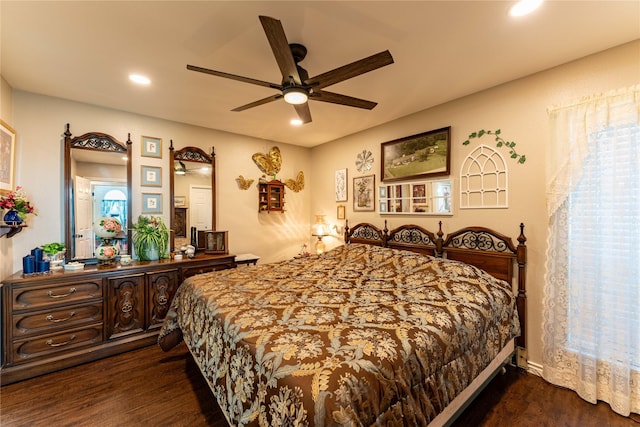 bedroom featuring ceiling fan and dark hardwood / wood-style floors