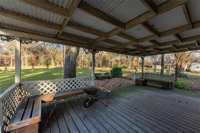 wooden deck featuring a yard