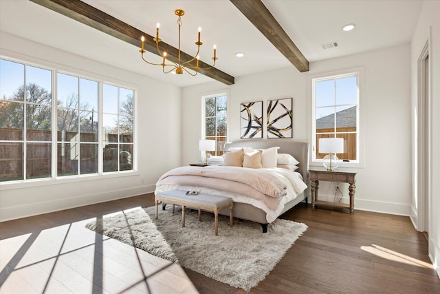 bedroom featuring multiple windows, beamed ceiling, dark wood-type flooring, and a notable chandelier